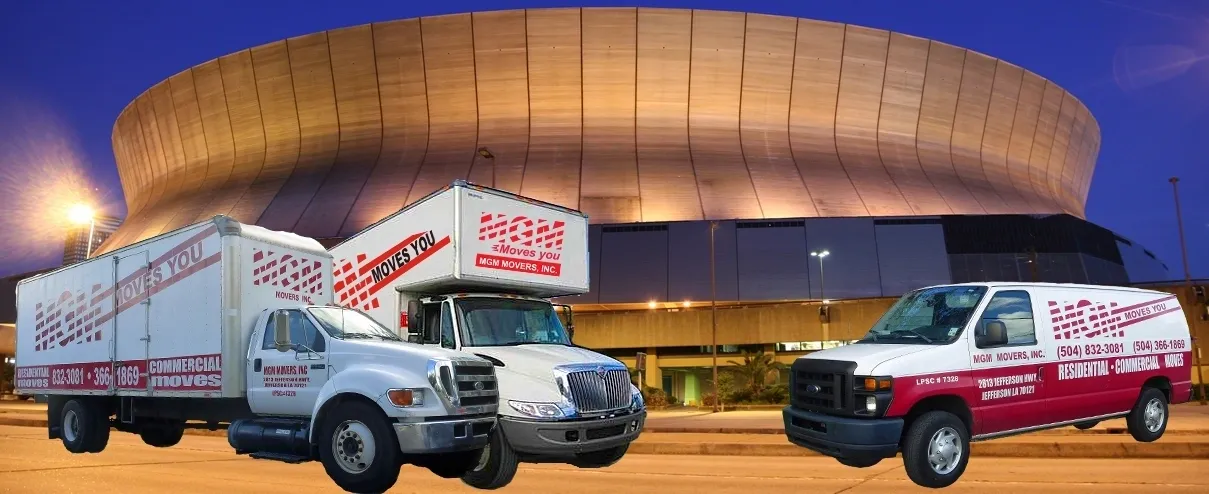 A truck and a car parked in front of a building.