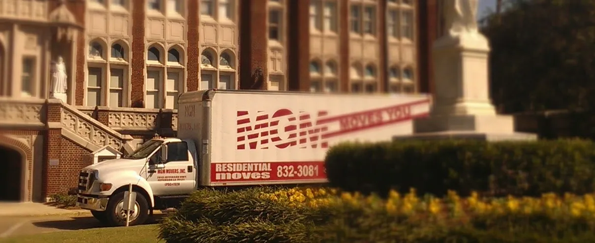 A white truck parked in front of a building.